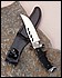 22051 Reliable hunting knife features durable 4mm stainless steel blade. Molded comfort-grip handle with etched chrome floral pattern. Includes belt-loop leather sheath. 