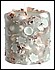 30094 Shells float inside this, ocean scented candle. 
