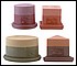 31040 A myriad of shapes and colors are found in this set of 4 scented designer candles. All rest on polyresin bases. 
