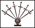 31238 An array of stainless steel swords in 6 different styles are displayed in this arrangement set on a wooden base.
